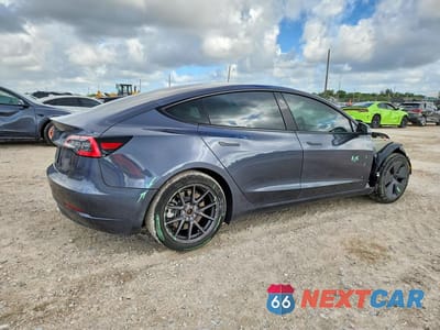 Trzecie zdjęcie samochodu z tyłu: 2021 TESLA MODEL 3 VIN:5YJ3E1EA1MF087839 - miniatura