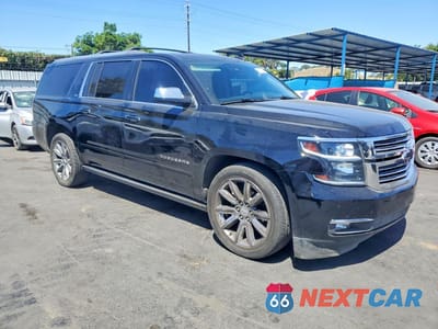 Czwarte zdjęcie samochodu z boku: 2016 CHEVROLET SUBURBAN VIN:1GNSKJKC0GR414750 - miniatura