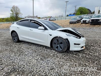 Czwarte zdjęcie samochodu z boku: 2021 TESLA MODEL 3 VIN:5YJ3E1EA0MF027437 - miniatura