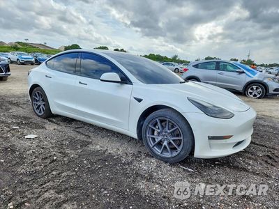 Czwarte zdjęcie samochodu z boku: 2022 TESLA MODEL 3 VIN:5YJ3E1EB1NF205558 - miniatura
