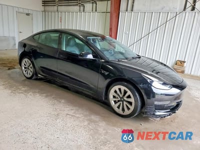 Czwarte zdjęcie samochodu z boku: 2022 TESLA MODEL 3 VIN:5YJ3E1EA9NF370569 - miniatura