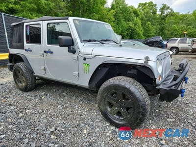 Czwarte zdjęcie samochodu z boku: 2010 JEEP WRANGLER UNLIMITED SPORT VIN:1J4BA3H11AL218110 - miniatura