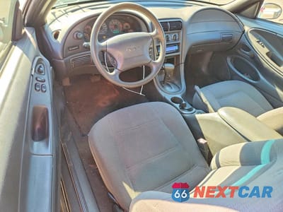Zdjęcie 8 z 13 samochodu: 1999 FORD MUSTANG VIN:1FAFP4040XF145388 - miniatura