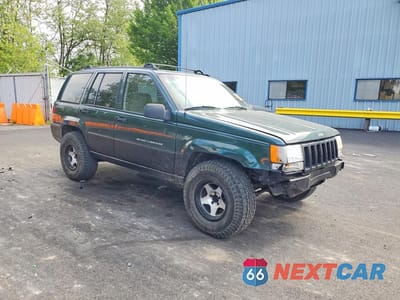 Czwarte zdjęcie samochodu z boku: 1998 JEEP GRAND CHEROKEE LAREDO VIN:1J4GZ58S2WC284191 - miniatura