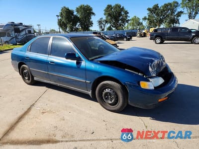 Czwarte zdjęcie samochodu z boku: 1994 HONDA ACCORD LX VIN:1HGCD5645RA051639 - miniatura