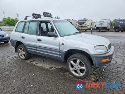 Czwarte zdjęcie samochodu z boku: 1997 TOYOTA RAV4 BASE VIN:JT3HP10V9V0128250 - miniatura
