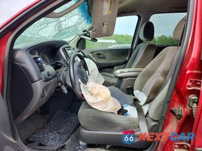 Zdjęcie 7 z 13 samochodu: 2003 MAZDA TRIBUTE VIN:4F2YZ04163KM46836 - miniatura