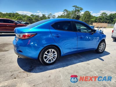 Trzecie zdjęcie samochodu z tyłu: 2016 SCION IA BASE VIN:3MYDLBZV2GY146162 - miniatura