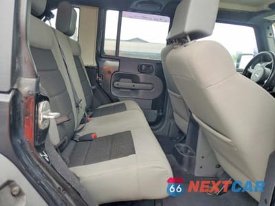 Zdjęcie 11 z 13 samochodu: 2010 JEEP WRANGLER UNLIMITED SAHARA VIN:1J4BA5H19AL162283 - miniatura