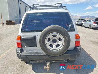 Zdjęcie 6 z 13 samochodu: 2000 CHEVROLET TRACKER VIN:2CNBJ13C0Y6939603 - miniatura