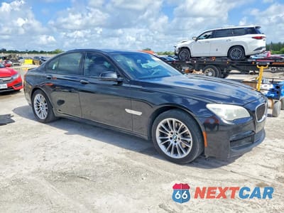 Czwarte zdjęcie samochodu z boku: 2015 BMW 740 I VIN:WBAYA6C58FGK16332 - miniatura