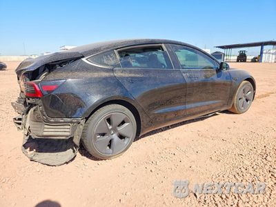 Trzecie zdjęcie samochodu z tyłu: 2023 TESLA MODEL 3 VIN:5YJ3E1EA4PF460120 - miniatura
