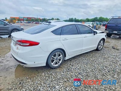 Trzecie zdjęcie samochodu z tyłu: 2018 FORD FUSION SE VIN:3FA6P0H77JR123714 - miniatura