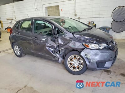 Czwarte zdjęcie samochodu z boku: 2016 HONDA FIT LX VIN:JHMGK5H52GX041039 - miniatura