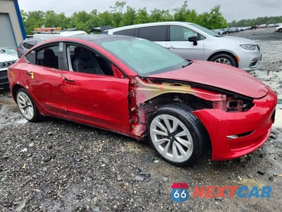 Czwarte zdjęcie samochodu z boku: 2023 TESLA MODEL 3 VIN:5YJ3E1EA4PF439008 - miniatura