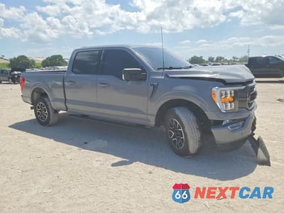 Czwarte zdjęcie samochodu z boku: 2023 FORD F150 SUPERCREW VIN:1FTFW1E57PFD10723 - miniatura