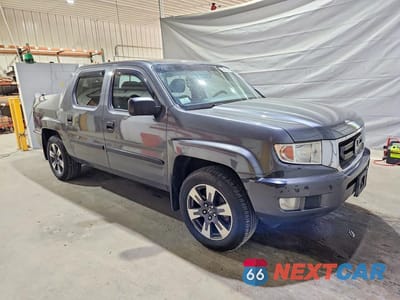 Czwarte zdjęcie samochodu z boku: 2011 HONDA RIDGELINE RT VIN:5FPYK1F29BB453220 - miniatura