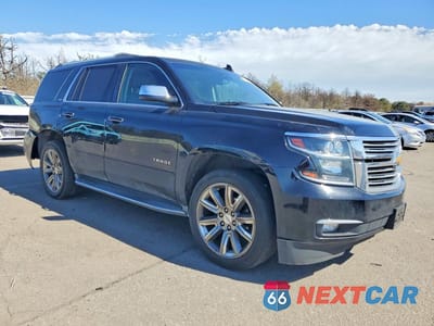 Czwarte zdjęcie samochodu z boku: 2015 CHEVROLET TAHOE K1500 LTZ VIN:1GNSKCKC1FR585128 - miniatura