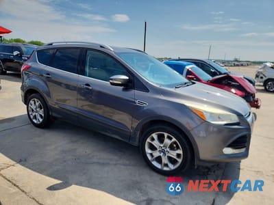 Czwarte zdjęcie samochodu z boku: 2014 FORD ESCAPE TITANIUM VIN:1FMCU0JX2EUB44576 - miniatura
