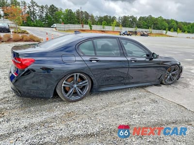Trzecie zdjęcie samochodu z tyłu: 2018 BMW 750 XI VIN:WBA7B0C55JG527229 - miniatura