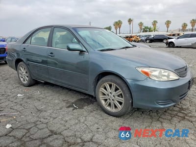 Czwarte zdjęcie samochodu z boku: 2002 TOYOTA CAMRY LE VIN:JTDBE32K420117173 - miniatura
