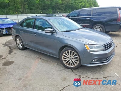 Czwarte zdjęcie samochodu z boku: 2015 VOLKSWAGEN JETTA SE VIN:3VWD07AJ9FM406072 - miniatura
