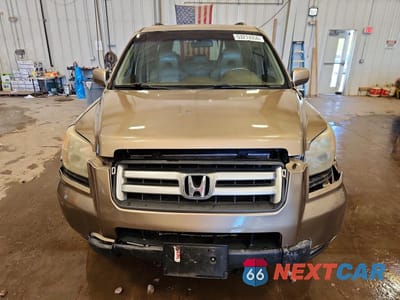 Piąte zdjęcie samochodu w środku: 2006 HONDA PILOT EX VIN:2HKYF18716H557620 - miniatura