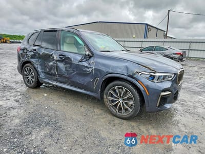 Czwarte zdjęcie samochodu z boku: 2022 BMW X5 M50I VIN:5UXJU4C03N9K49793 - miniatura