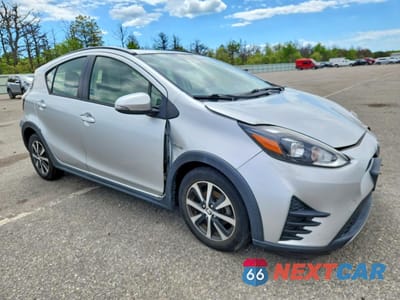 Czwarte zdjęcie samochodu z boku: 2018 TOYOTA PRIUS C ONE VIN:JTDKDTB35J1610431 - miniatura