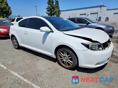 Czwarte zdjęcie samochodu z boku: 2005 SCION TC BASE VIN:JTKDE167250029593 - miniatura