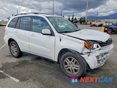 Czwarte zdjęcie samochodu z boku: 2002 TOYOTA RAV4 BASE VIN:JTEGH20V320060402 - miniatura