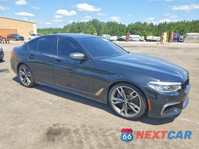 Czwarte zdjęcie samochodu z boku: 2020 BMW M550XI VIN:WBAJS7C05LCD53856 - miniatura