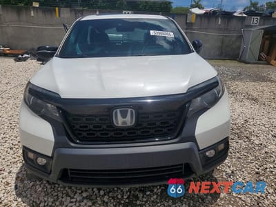 Piąte zdjęcie samochodu w środku: 2020 HONDA PASSPORT EXL VIN:5FNYF7H59LB003317 - miniatura