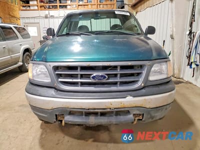 Piąte zdjęcie samochodu w środku: 2000 FORD F150 VIN:2FTPX18Z6YCA27727 - miniatura