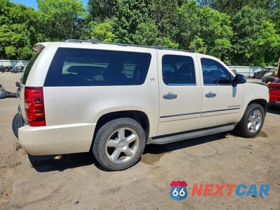 Trzecie zdjęcie samochodu z tyłu: 2011 CHEVROLET SUBURBAN C1500 LTZ VIN:1GNSCKE05BR376977 - miniatura