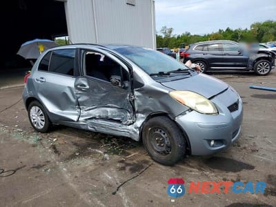 Czwarte zdjęcie samochodu z boku: 2010 TOYOTA YARIS BASE VIN:JTDKT4K34A5320196 - miniatura