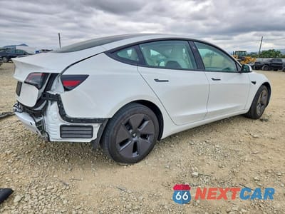 Trzecie zdjęcie samochodu z tyłu: 2023 TESLA MODEL 3 VIN:5YJ3E1EA7PF607255 - miniatura