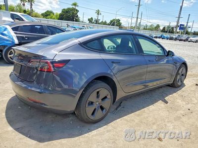 Trzecie zdjęcie samochodu z tyłu: 2023 TESLA MODEL 3 VIN:5YJ3E1EA6PF417415 - miniatura