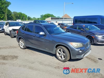 Czwarte zdjęcie samochodu z boku: 2014 BMW X1 SDRIVE28I VIN:WBAVM1C52EVW52083 - miniatura