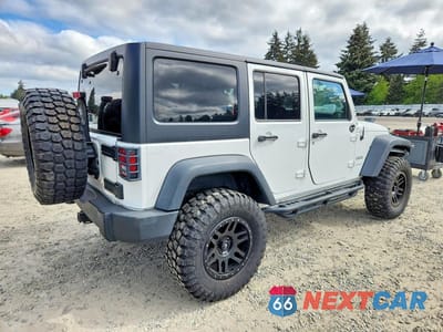 Trzecie zdjęcie samochodu z tyłu: 2014 JEEP WRANGLER UNLIMITED SPORT VIN:1C4BJWDG5EL145797 - miniatura