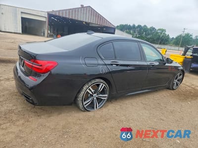 Trzecie zdjęcie samochodu z tyłu: 2018 BMW 740 I VIN:WBA7E2C57JG743313 - miniatura