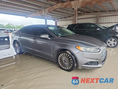 Czwarte zdjęcie samochodu z boku: 2014 FORD FUSION TITANIUM VIN:3FA6P0D9XER290629 - miniatura