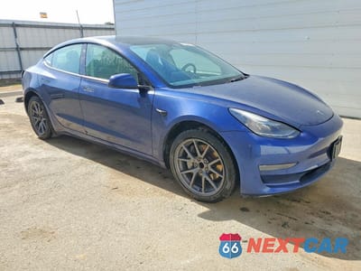 Czwarte zdjęcie samochodu z boku: 2022 TESLA MODEL 3 VIN:5YJ3E1EA7NF290865 - miniatura