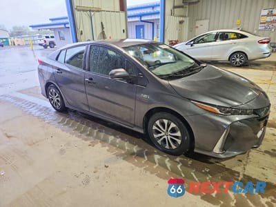 Czwarte zdjęcie samochodu z boku: 2022 TOYOTA PRIUS PRIME XLE VIN:JTDKAMFP2N3219050 - miniatura