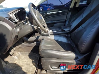 Zdjęcie 7 z 12 samochodu: 2019 FORD FUSION TITANIUM VIN:3FA6P0D9XKR184662 - miniatura