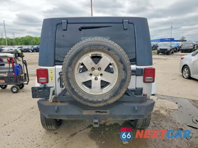 Zdjęcie 6 z 13 samochodu: 2009 JEEP WRANGLER UNLIMITED SAHARA VIN:1J4GA59119L751666 - miniatura