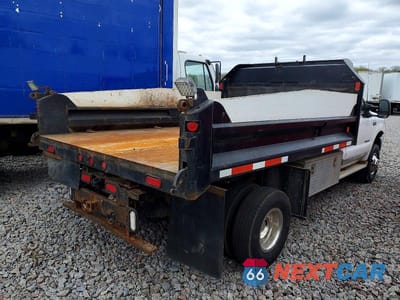 Czwarte zdjęcie samochodu z boku: 1999 FORD F350 SUPER DUTY DUMP TRUCK VIN:1FDWF37FXXEC62430 - miniatura
