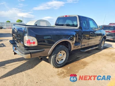 Trzecie zdjęcie samochodu z tyłu: 2000 FORD F150 VIN:1FTRX08L6YKB35548 - miniatura