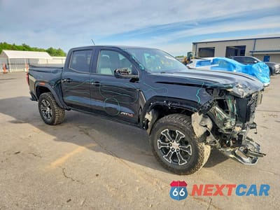 Czwarte zdjęcie samochodu z boku: 2024 GMC CANYON AT4 VIN:1GTP6DEK5R1318184 - miniatura