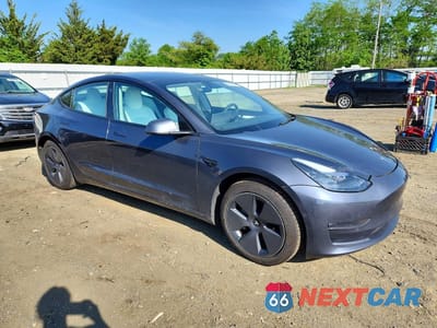 Czwarte zdjęcie samochodu z boku: 2022 TESLA MODEL 3 VIN:5YJ3E1EB4NF203190 - miniatura